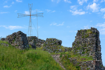 ancient historical ruined fortress with a cross in Georgia