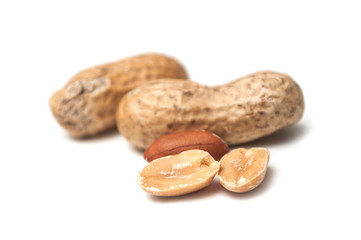 closeup of organic peanuts on white background