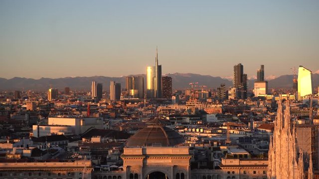 Italy , Milan december 13,2019 - Amzing view of the downtown of the city from Terrazza Martini rooftop during the sunset - Duomo cathedral , Vittorio Emanuele Gallery and skyline with new skyscepers  