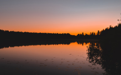 Fototapeta na wymiar Beautiful sunset over the lake