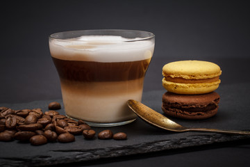 Coffee cappuccino and coffee beans on black background