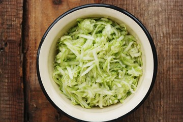Fresh zucchini grated on a grater macro