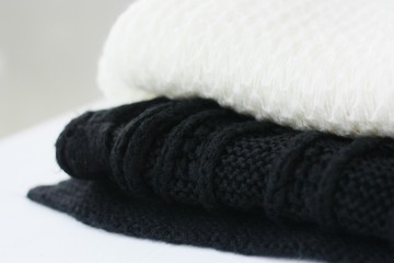 Beautiful white and black scarves close up view