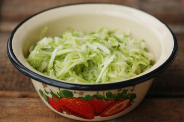Fresh zucchini grated on a grater macro