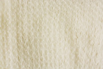 Beautiful white knitted scarf close up view 