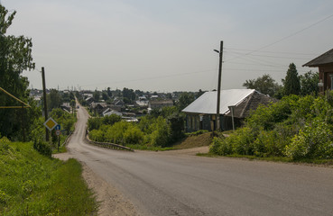 Shot of village road and some cottages in summer