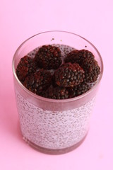 glass of chia pudding with blackberry flavor