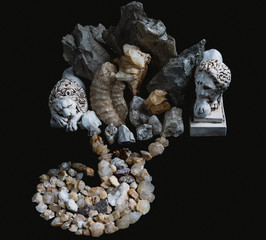 Composition of fossilized animal remains, stones, minerals and figurines