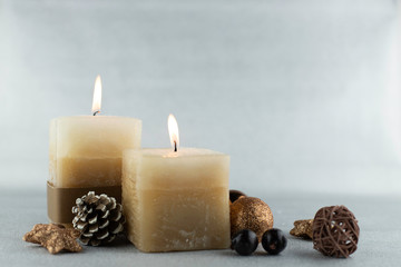 candles and stones on a white background