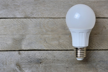 LED lamp on a wooden background. copy space
