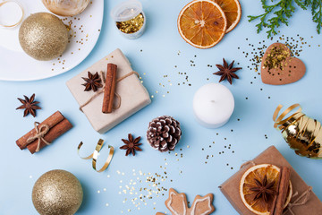 Christmas decorations and Christmas gifts on a blue background. View from above