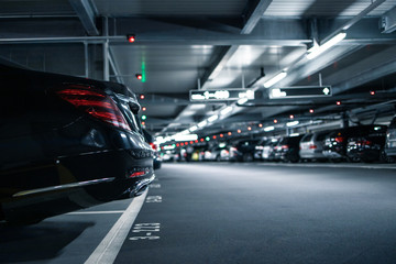 Underground garage or modern car parking with lots of vehicles - Powered by Adobe