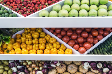 assortment of ripe fruits and vegetables on the store counter. Background of fruit and vegetable harvest