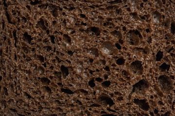 Sliced rye bread texture. Flat lay, top view, close-up