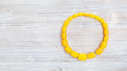 top view of vintage yellow amber necklace on gray