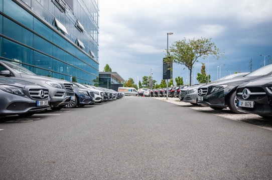 Mercedes Benz cars parked in row