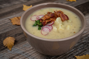 Potato Soup Topped with Bacon, Radish Greens and Radishes