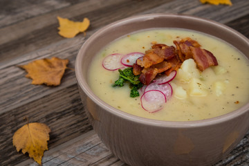 Potato Soup Topped with Bacon, Radish Greens and Radishes