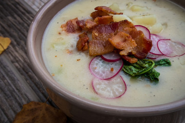 Potato Soup Topped with Bacon, Radish Greens and Radishes