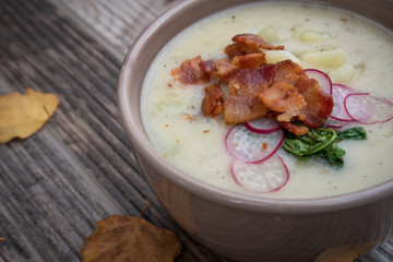 Potato Soup Topped with Bacon, Radish Greens and Radishes