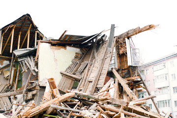 Destroyed old wooden house. Demolition of the house.