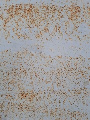  close-up of a decorative wall, with bokeh effect and characteristic rough porous texture, abstract dark and light stains