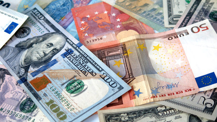 Obraz na płótnie Canvas Close-up of euro and dollars banknotes used for background.