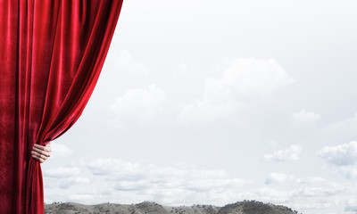 Summer natural bluesky view behind red velvet curtain