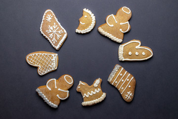 Cookies background. Christmas homemade gingerbread cookies on dark. Celebration cooking Winter concept. New year and christmas postcard or invitation