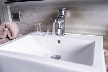 Fototapeta premium Modern bathroom faucet, Very high end faucet, sink, and counter in a luxury bathroom