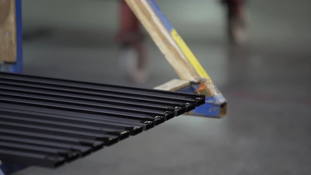 Coloured Aluminum profiles after process of anodizing of aluminum in the enterprise. Metal processing. production line factory