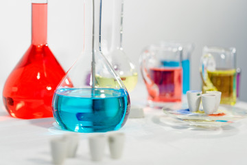 Scientific biochemical liquid research biochemistry bottles glass erlenmeyer flask equipment with colorful liquids experimental study discover new medicine pharmacy industry in laboratory