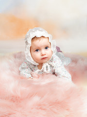 Attractive 6 month old baby girl in colorful dress