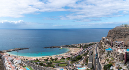 Naklejka premium Beautiful stunning panoramic view of Puerto Rico. Playa de Amadores beach on Gran Canaria island in Spain near Tenerife island.