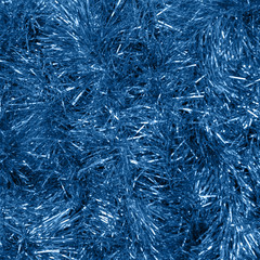 Abstract background, shiny blue tinsel.The blue color of the 2020 concept.