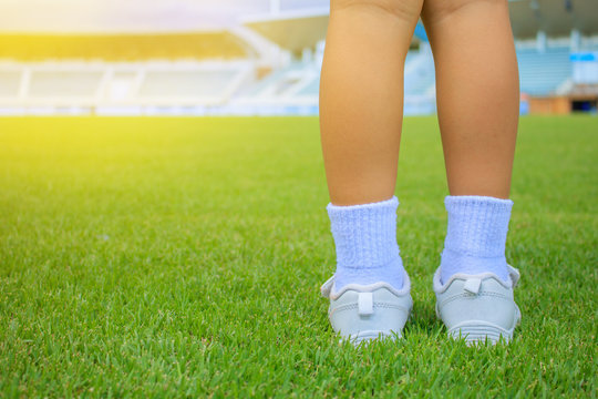 Sports white shoes are on the lawn.Concept love health, exercise, sports.