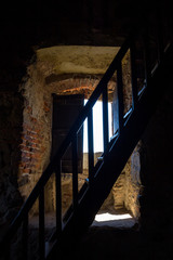 old wooden staircase in front of a window