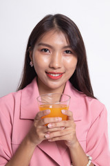 Young Asian woman drink orange juice.