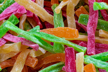 Lot of slices of multicolors marmalade. Front view.