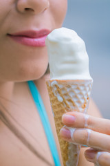 Ice cream ( sorvete expresso ) Picture of a young woman eating ice cream.	