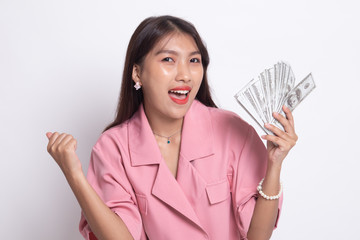 Portrait of  young asian woman  showing bunch of money banknotes.