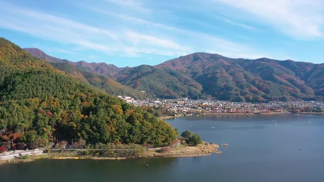 Aerial view 4k video by drone of beautiful Japan autumn at lake Kawaguchiko with red leaves