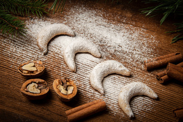sweet christmas cookies Vanillekipferl on old wooden table