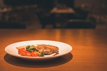 chicken steak in the desk and food painting in the restaurant.