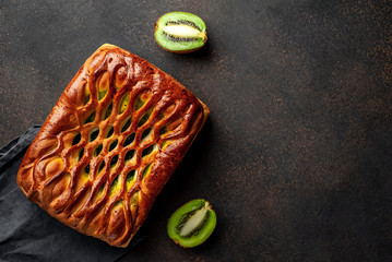 delicious kiwi filling pie on stone background with copy space for your text