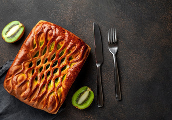 delicious kiwi filling pie on stone background with copy space for your text