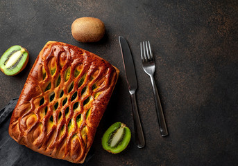 delicious kiwi filling pie on stone background with copy space for your text