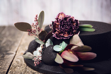 Chocolate velour cake decorated with amazing flowers on wooden background
