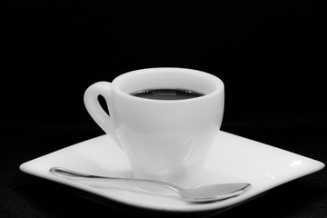 Cup of coffee on black background