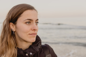 portrait of a Spanish Caucasian girl on a beach in Valencia, Spain